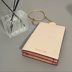 Charles and Keith Light Pink Leather Clutch Bag With Fine Golden Loop Handle